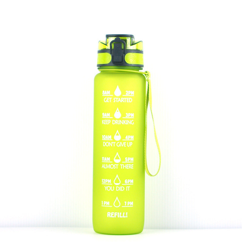 Green 1000ml water bottle with time markers, flip-top lid, and wrist strap for convenient hydration tracking.