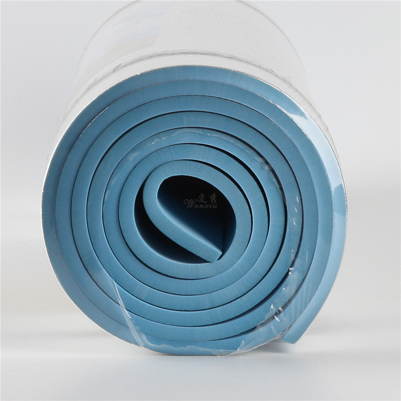 Close-up of rolled microfiber yoga mat with soft blue EVA interior. Lightweight and durable for yoga, pilates, and fitness routines.