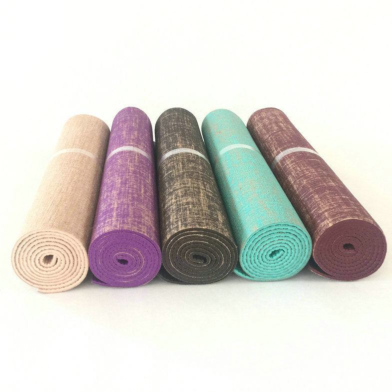 Five rolled sackcloth yoga mats in different colors, featuring a textured jute surface and PVC backing. Ideal for fitness, dance, and health routines.