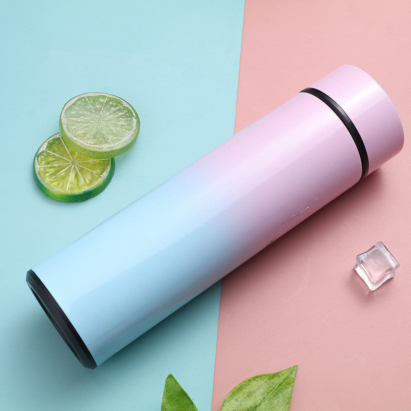 Pink and blue gradient stainless steel vacuum flask with temperature display, perfect for travel, coffee, and soup. Keeps beverages hot or cold for hours.