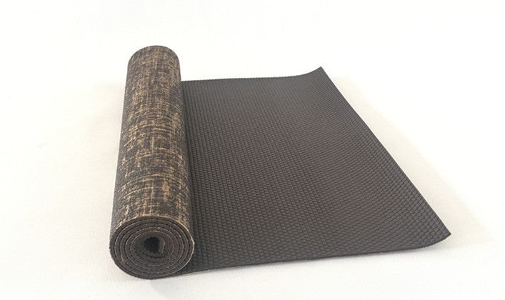 Brown sackcloth yoga mat partially unrolled, showcasing a textured jute surface and durable PVC backing. Ideal for yoga, pilates, and fitness training.