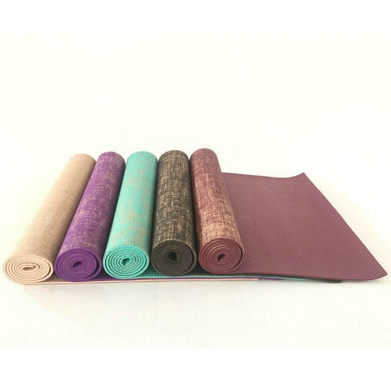 Partially unrolled sackcloth yoga mats in multiple colors, revealing a textured non-slip PVC base. Designed for comfort and stability in workouts.