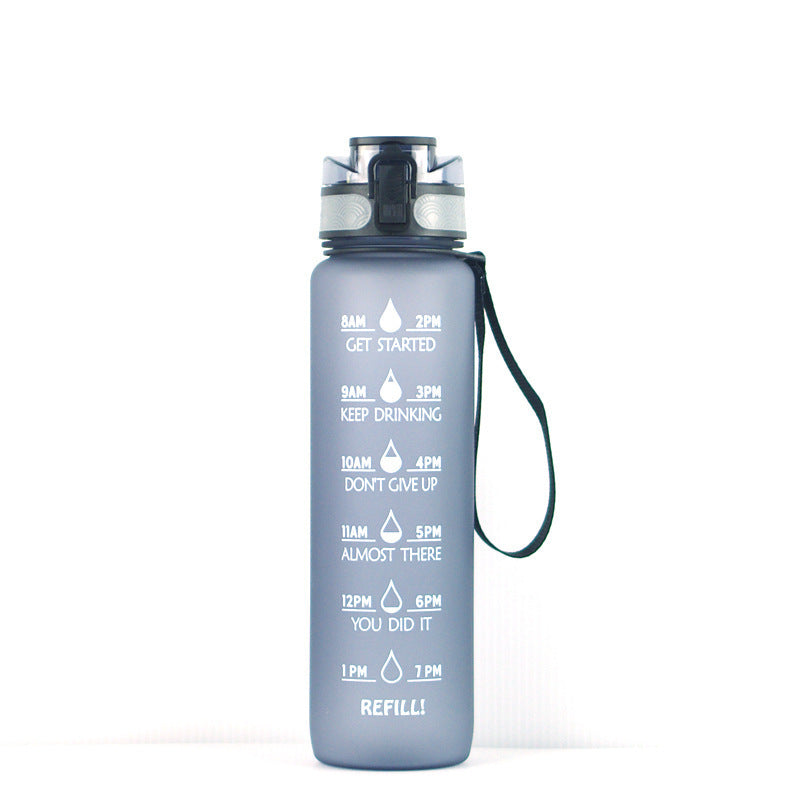 Gray 1000ml water bottle with time markers, leakproof lid, and wrist strap for hydration tracking.