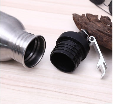 Close-up of stainless steel outdoor sports water bottle with a detachable screw cap and built-in bottle opener.