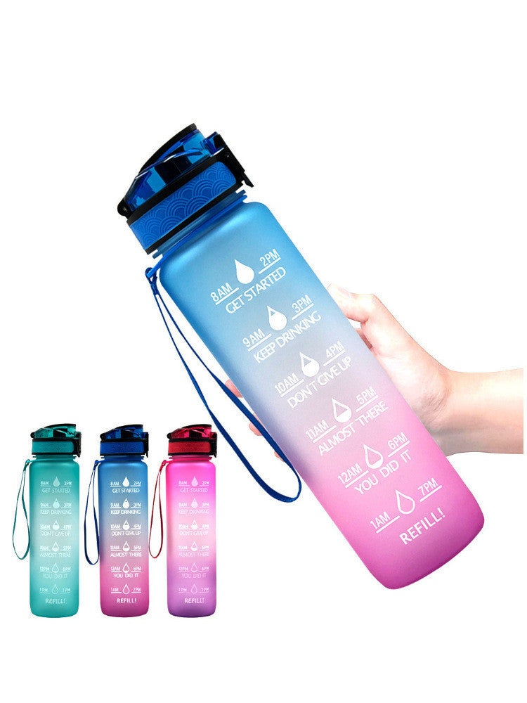 Blue and pink gradient 1000ml water bottle with time markers, secure lid, and wrist strap for daily hydration goals.