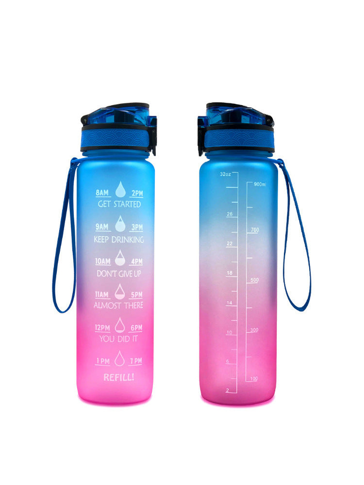 Pink and blue gradient 1000ml water bottle with time markers, leakproof lid, and wrist strap for hydration tracking.